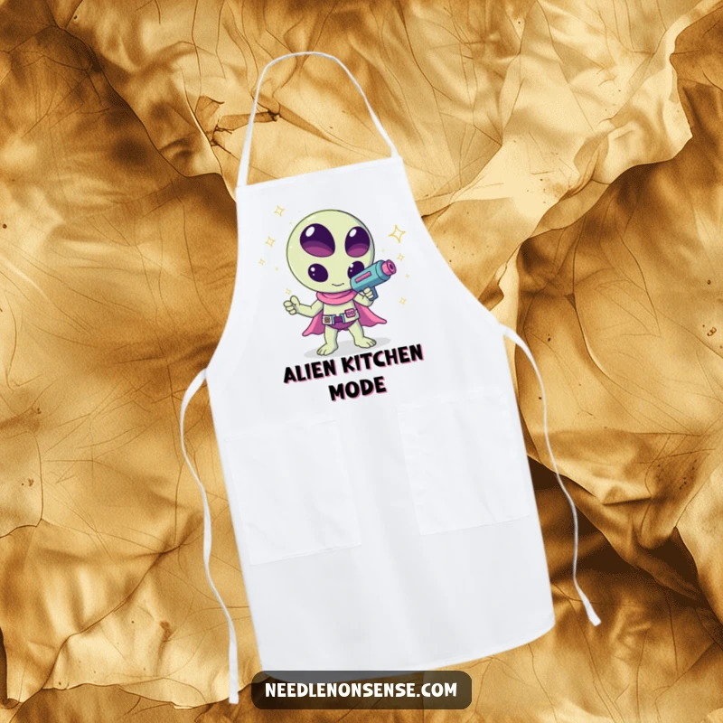 Funny kawaii alien waving a ray gun shooting sparkles, a humorous and cheerful design on this kitchen apron, great for cooking.