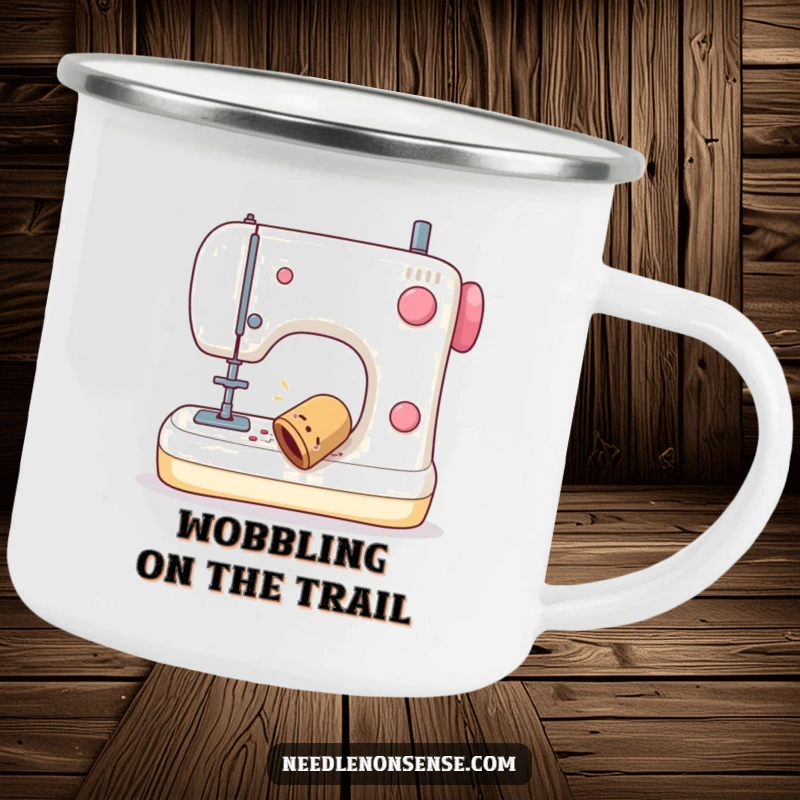 Funny camping mug showing a sewing thimble wobbling off a sewing machine, perfect for outdoor enthusiasts and crafters.