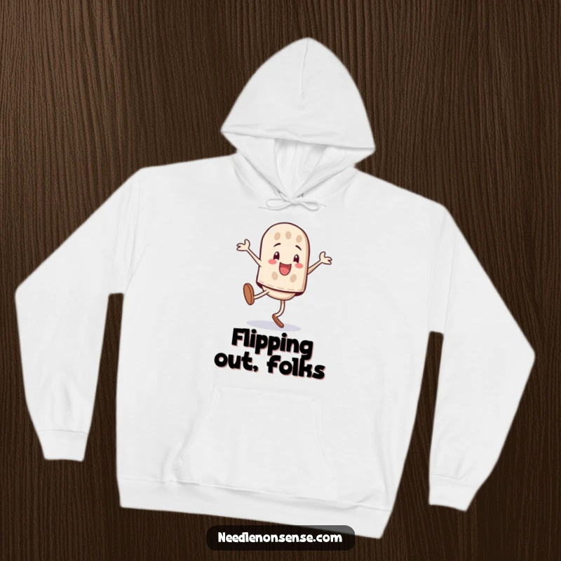 Funny playful thimble character performing a triumphant cartwheel, graphic on a cozy hoodie.