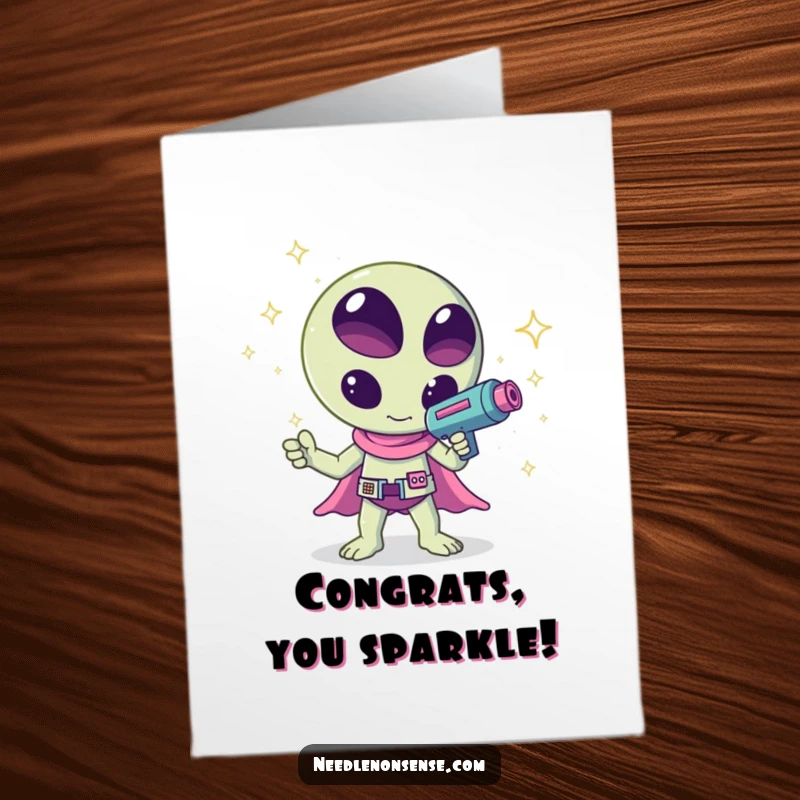 Funny Free Printable Congratulations Card: A happy kawaii alien fires a ray gun that shoots dazzling sparkles to celebrate success.