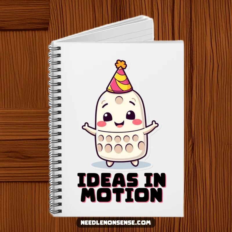 Funny notebook with a smiling thimble character in a party hat, spinning joyfully, perfect for notes and plans.