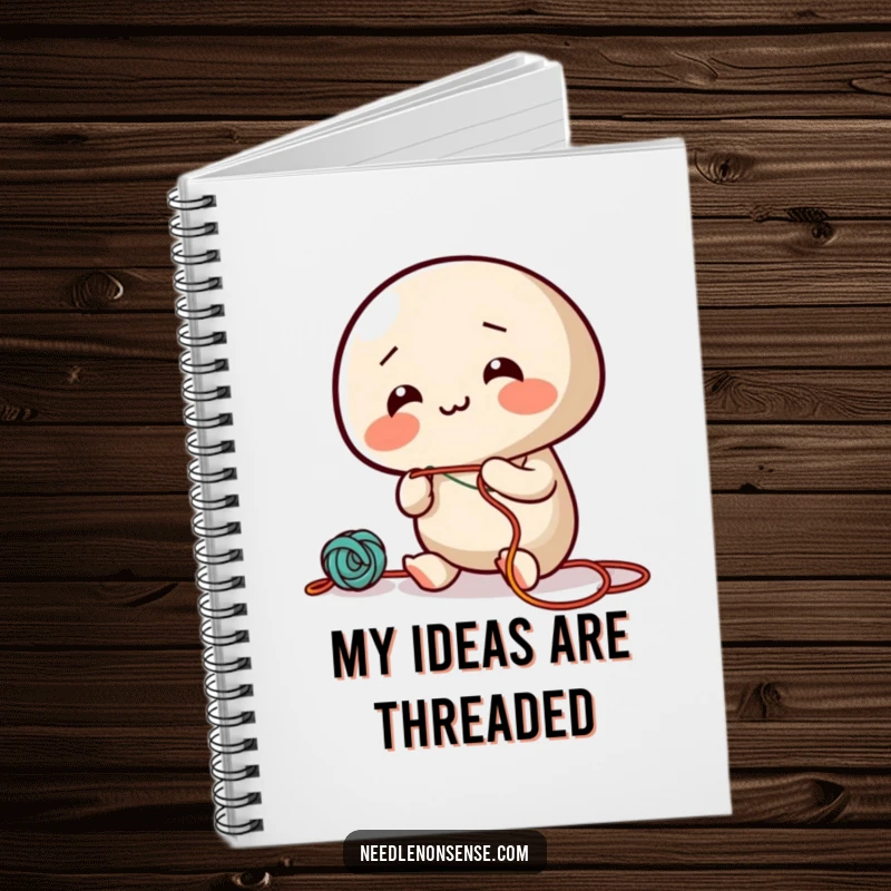 Funny notebook featuring a giggling needle character enthusiastically threading colorful string, for jotting down creative ideas.