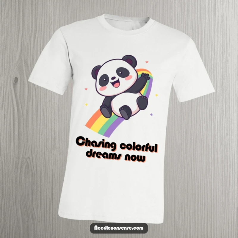 Funny Kawaii Panda t-shirt depicting a happy panda sliding down a bright rainbow, full of glee.